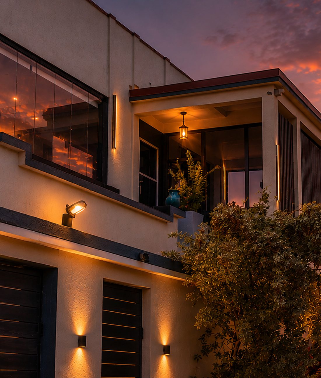 A private villa glowing at dusk