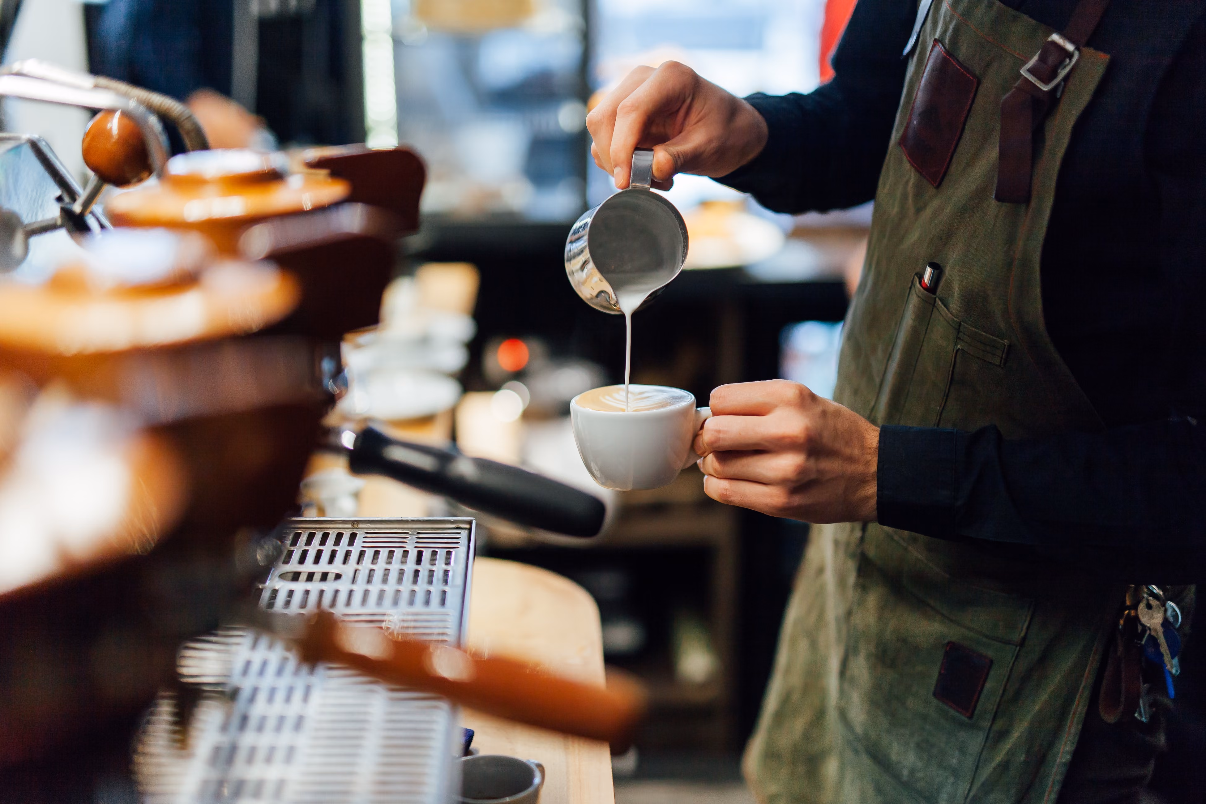 Barista pouring coffee stock image