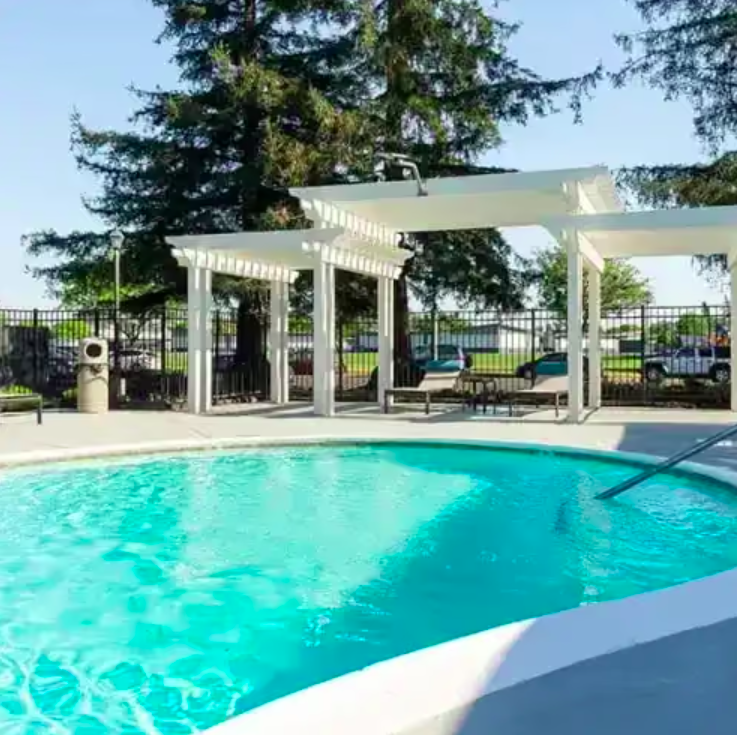 Swimming pool with lounge chairs.