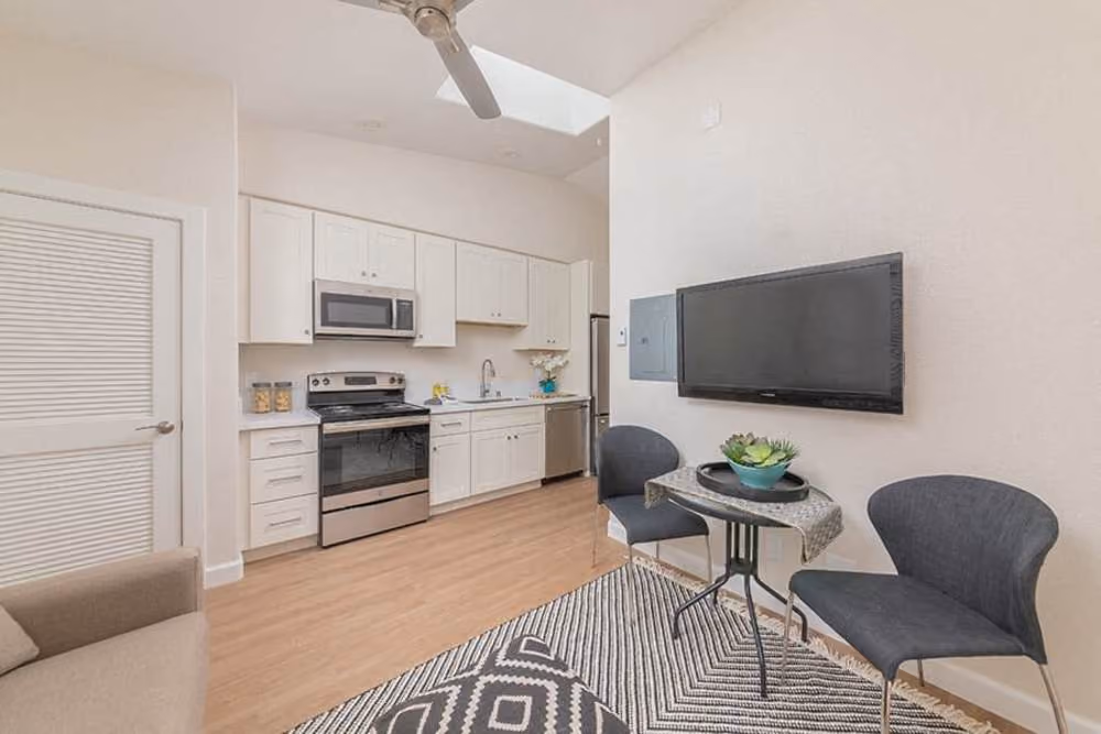 Dining area with table and chairs and view of kitchen