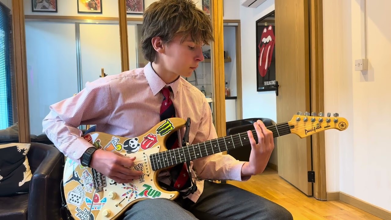 Guitar student after 5 years of lessons