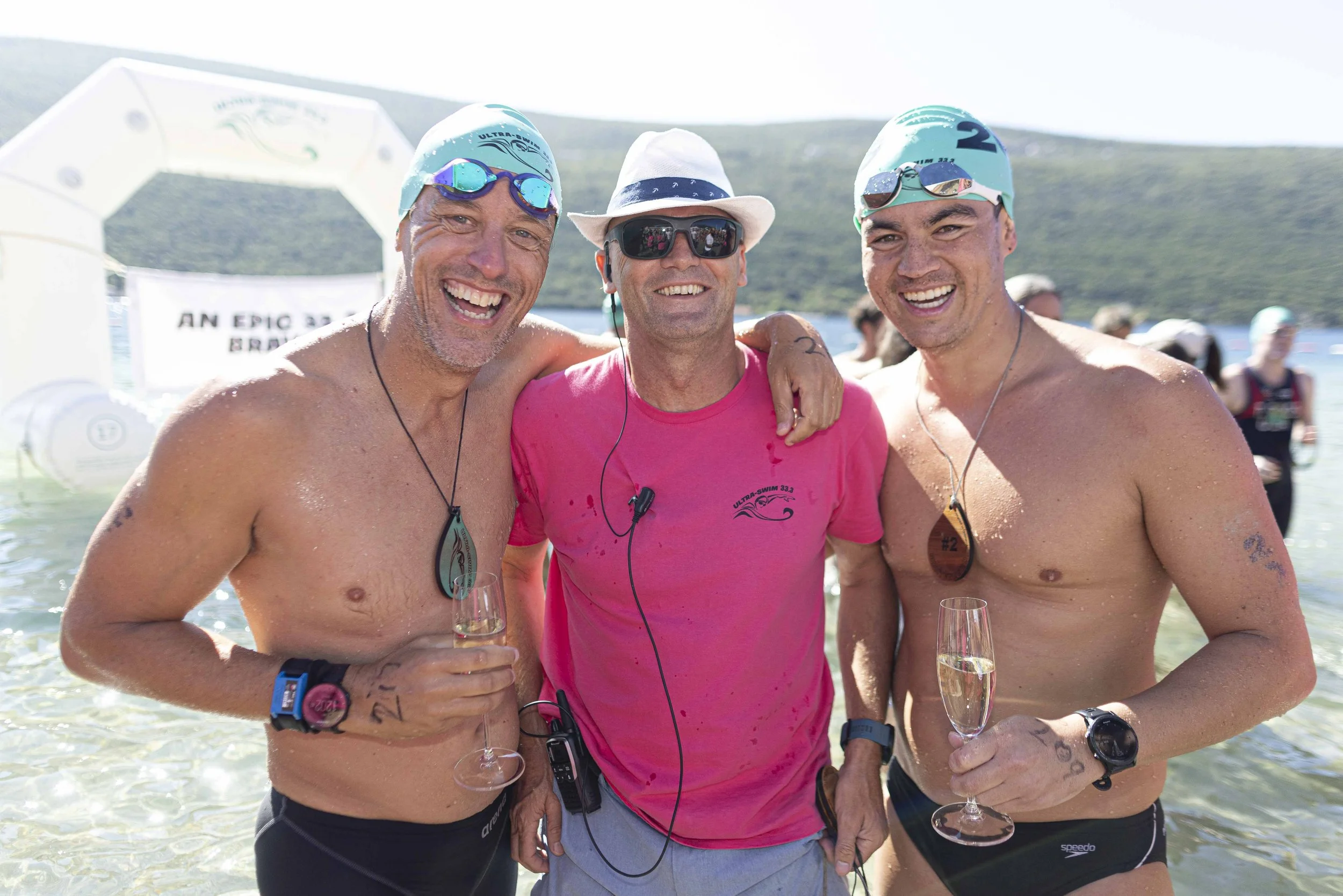 From left to right, Jay Prchal (Andy’s Mentor), UltraSwim 33.3 Founder and CEO Mark Turner and far right Andy Donaldson at the finish line of #2Montenegro October 2023. Image by Lloyd Images / UltraSwim 33.3