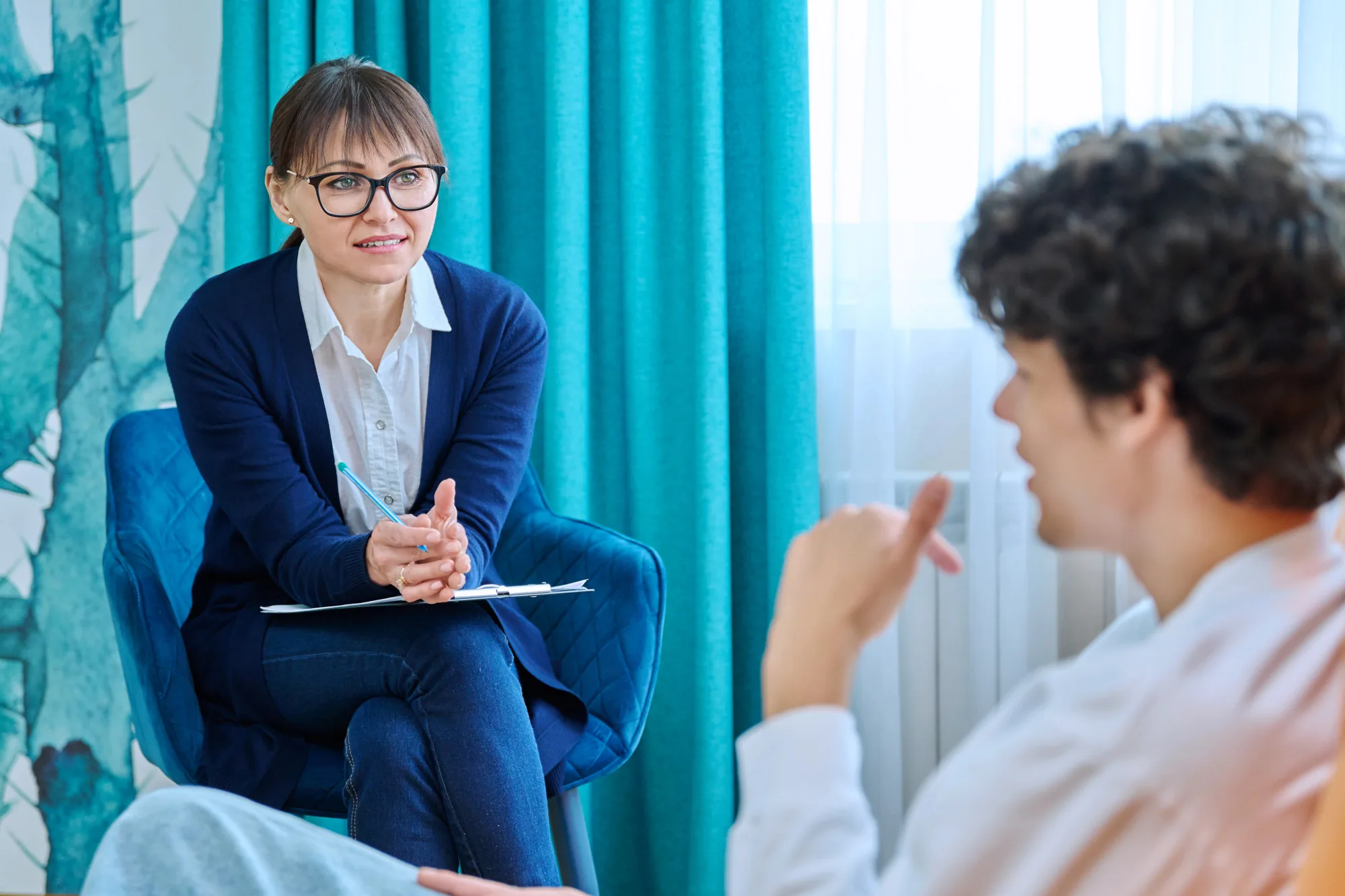 Behavioral Health Technician professional working with a client, featured image for the blog post "What Does a Behavioral Health Technician Do?"