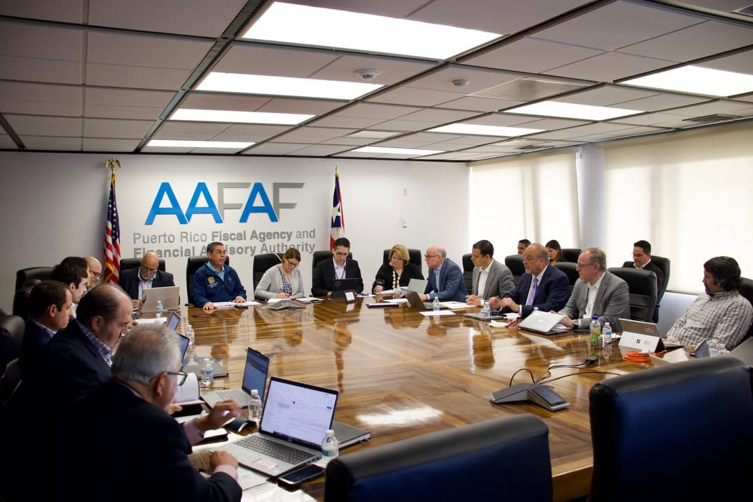 Eng. Josué A. Colón Ortiz discusses with AES executives and officials at government offices.