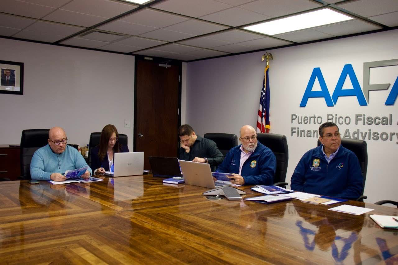 Eng. Josué A. Colón Ortiz discusses with IBTS representatives at government offices.