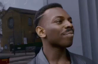 Gif of someone pointing to there temple to signify thinking and strategy