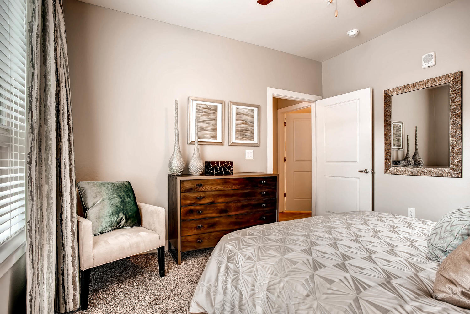 Bedroom staged with bed