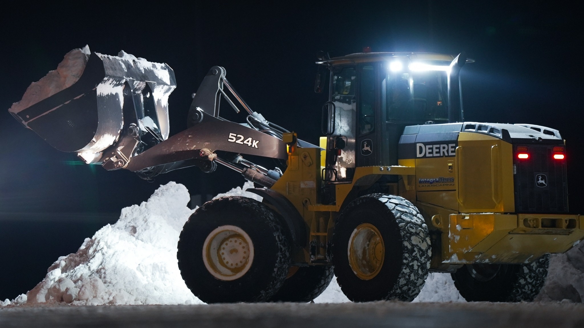 John Deer 524k removing snow