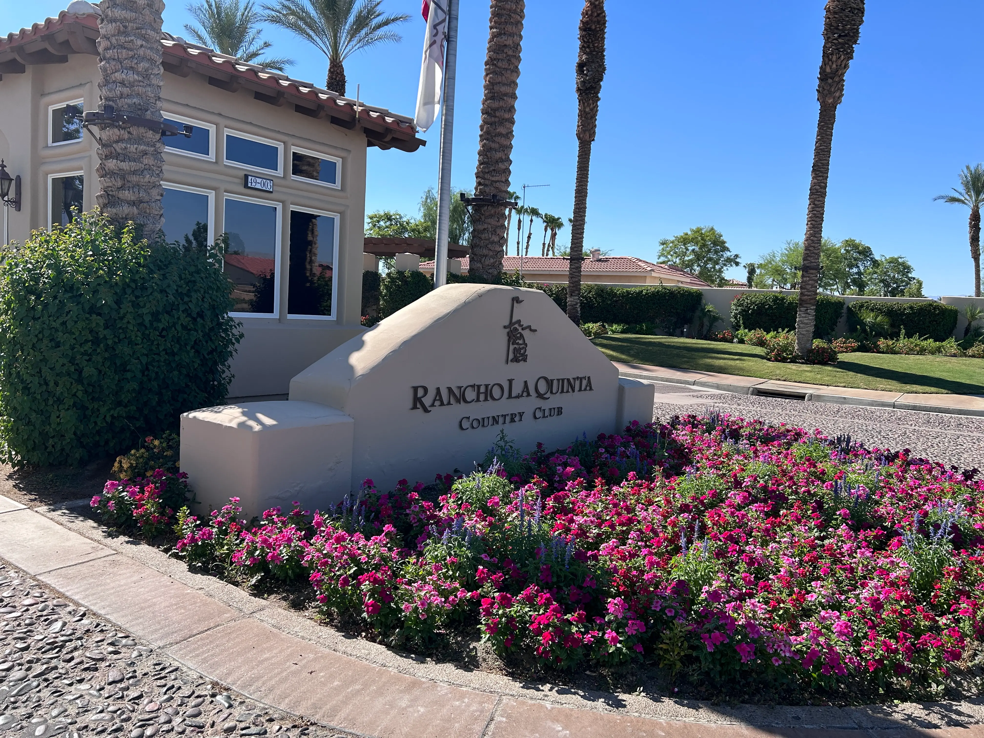 The Rancho La Quinta Country Club entrance monument, representing premium water conditioning and plumbing services for exclusive golf communities.