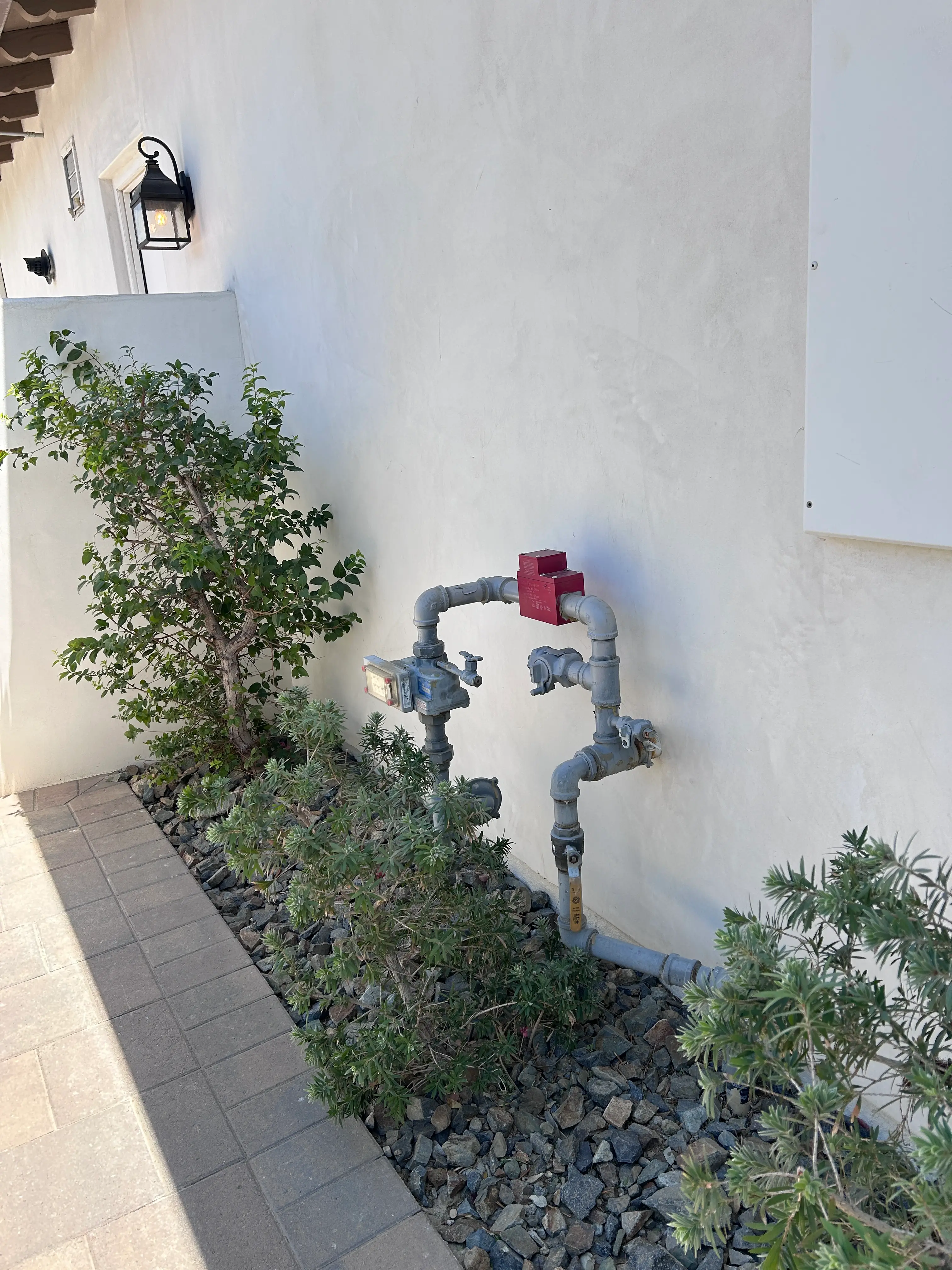 On-site 24/7 emergency water heater replacement service performed at night for a residential home in Palm Springs, California.