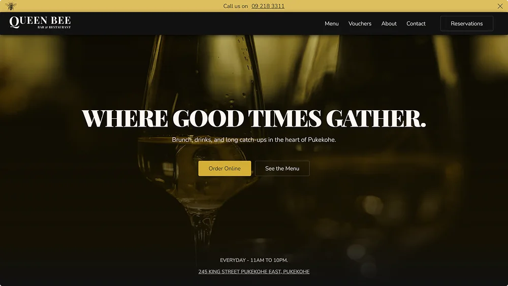 Queen Bee Bar website homepage with wine glasses and tagline 'Where Good Times Gather' in dark theme.