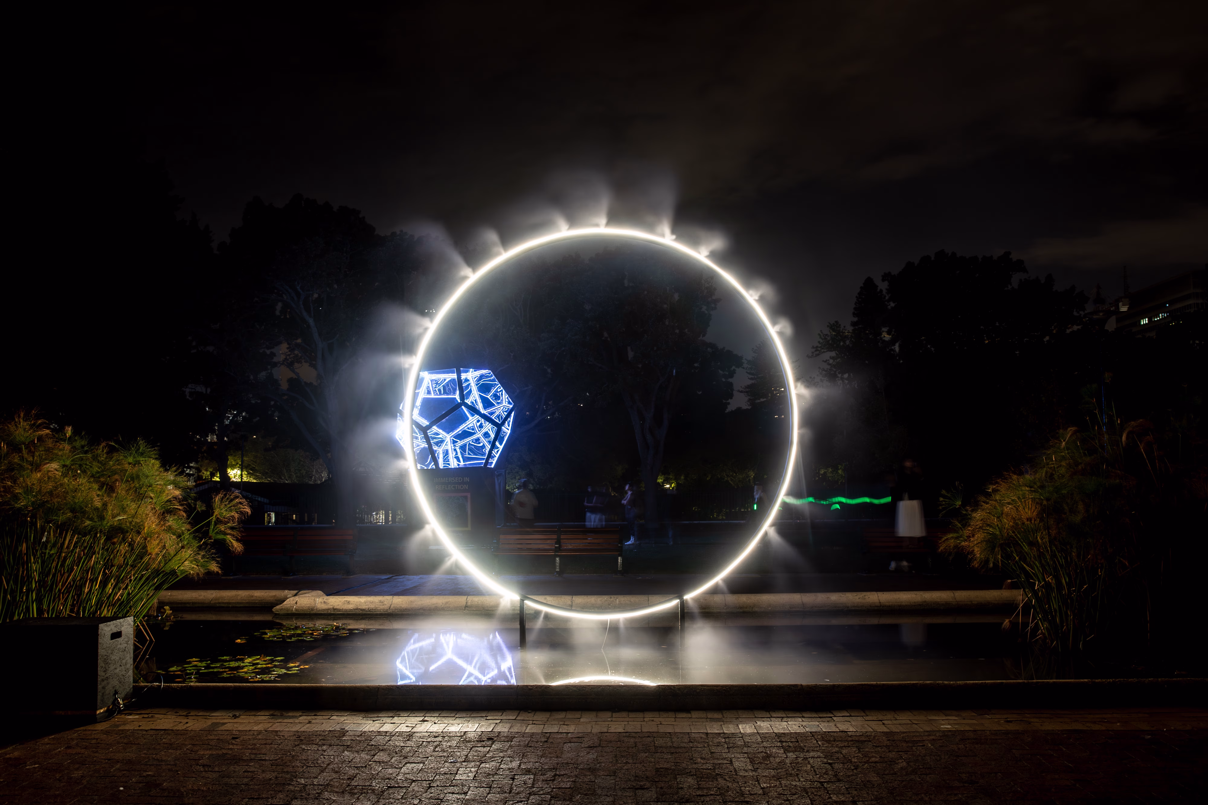 Alt Ring Portal by Alan Bradburn, a ring of light suspended over water at LUMENOCITY, Cape Town