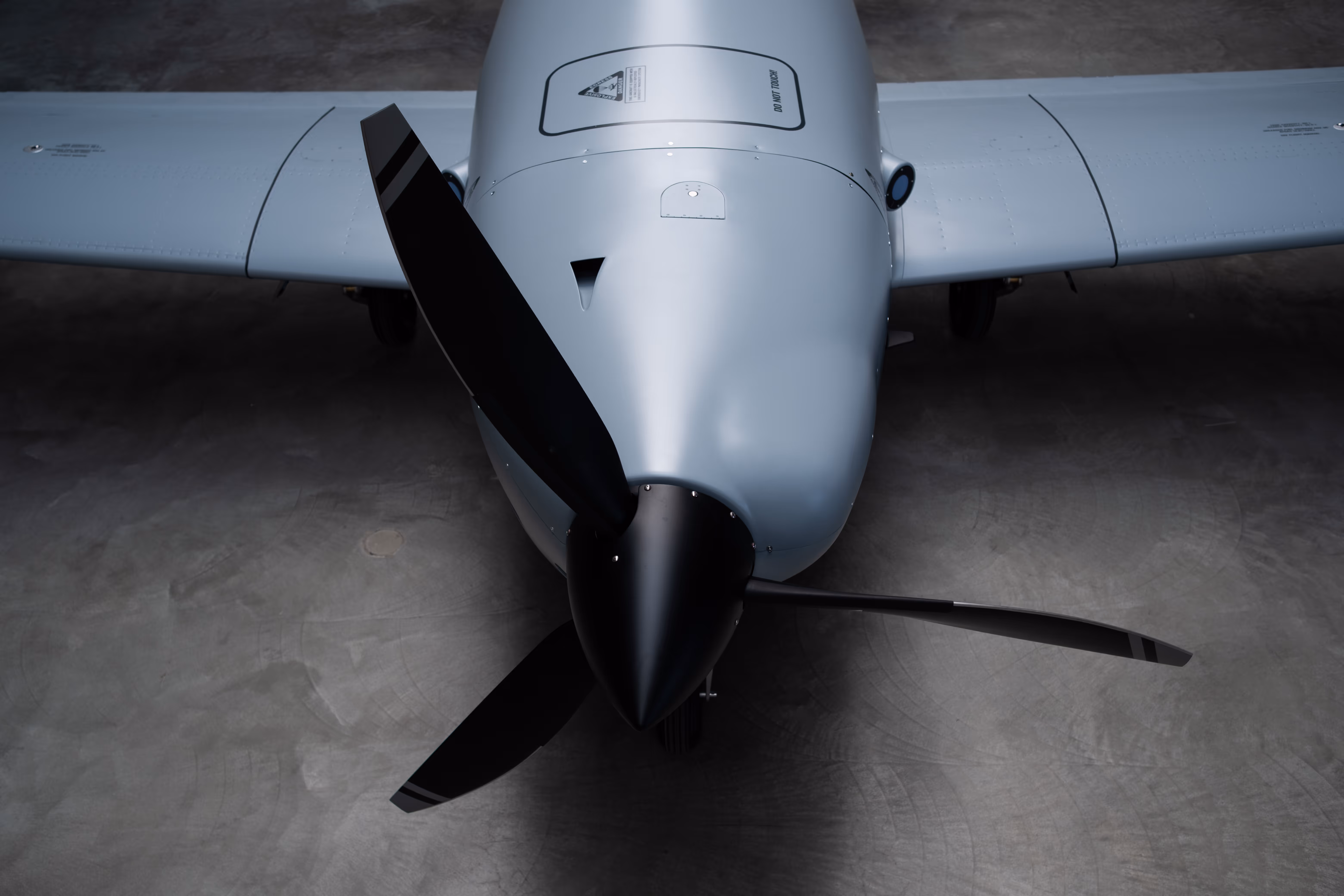 Front view of the Bussard drone's nose, propeller, and wings from above.