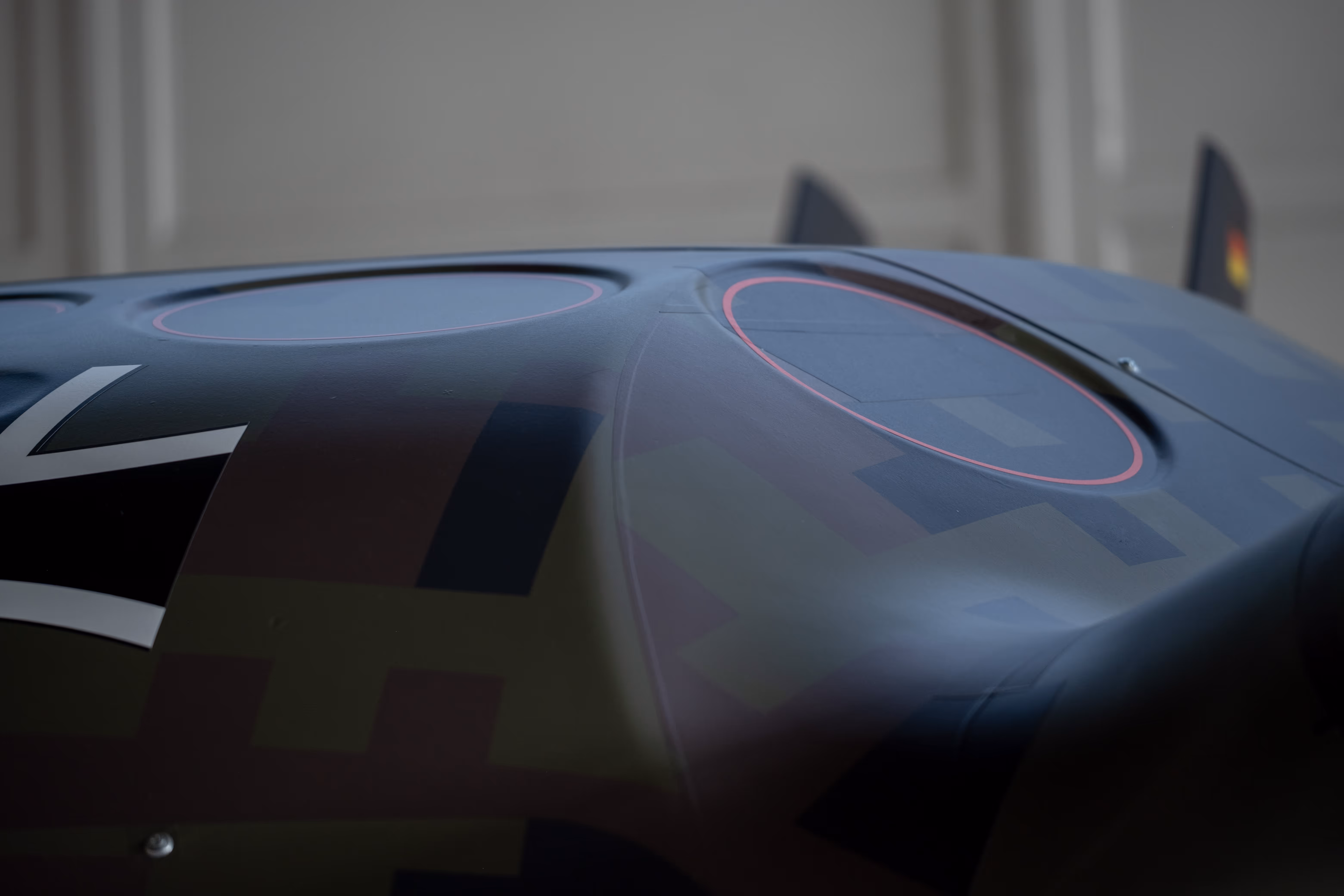 Close-up of the Grille drone's camouflaged fuselage with covered rotor openings and German insignia.