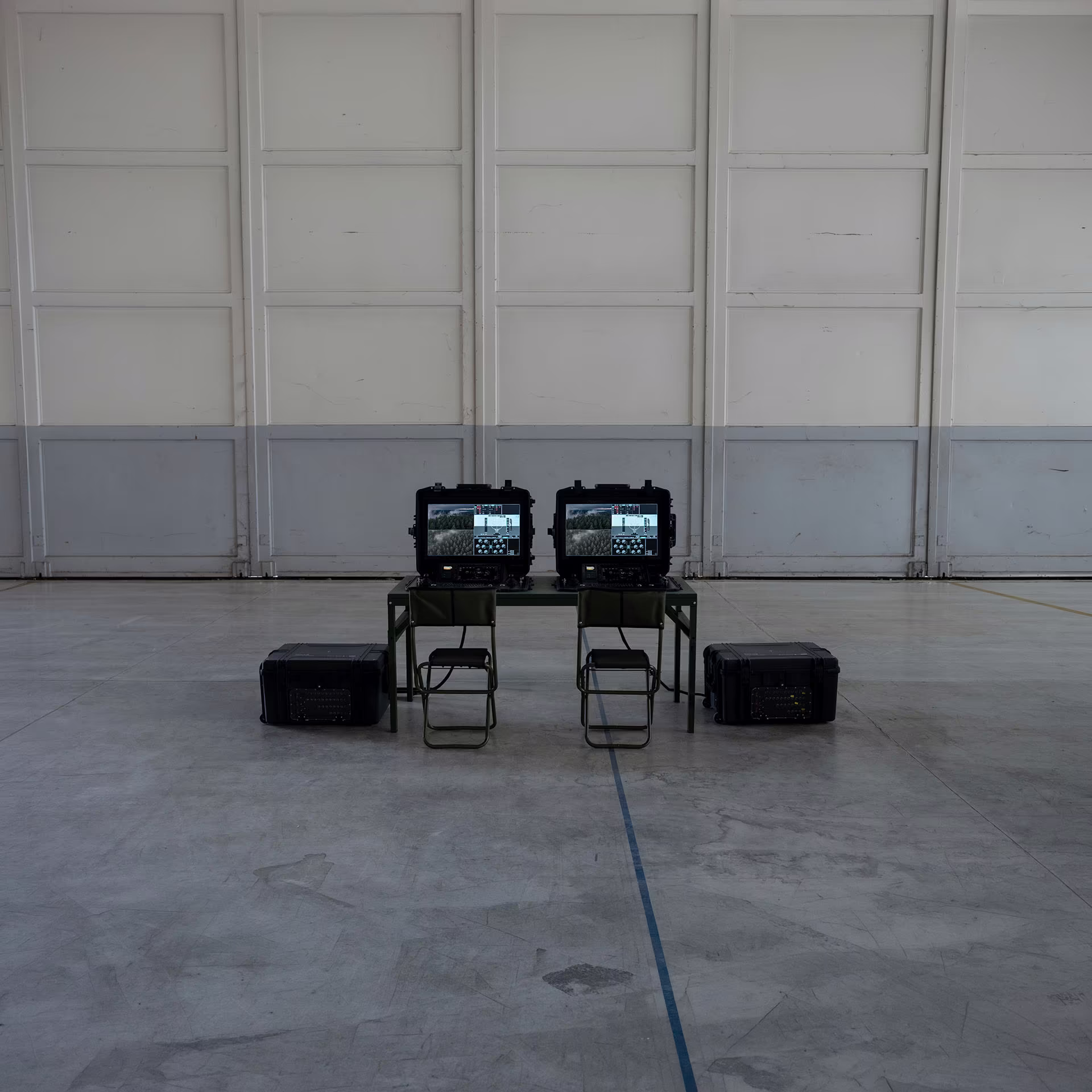 RasCore Ground remote pilot stations set up inside a hangar