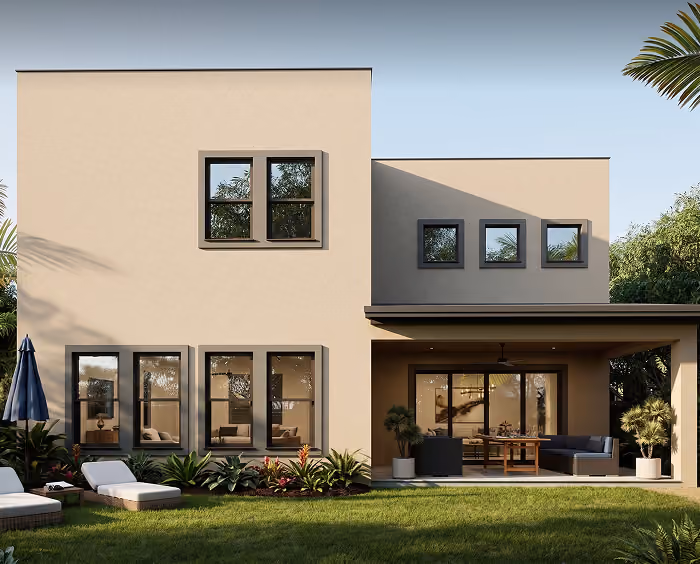 Modern two-story house with large windows, patio furniture, and a green lawn in front.