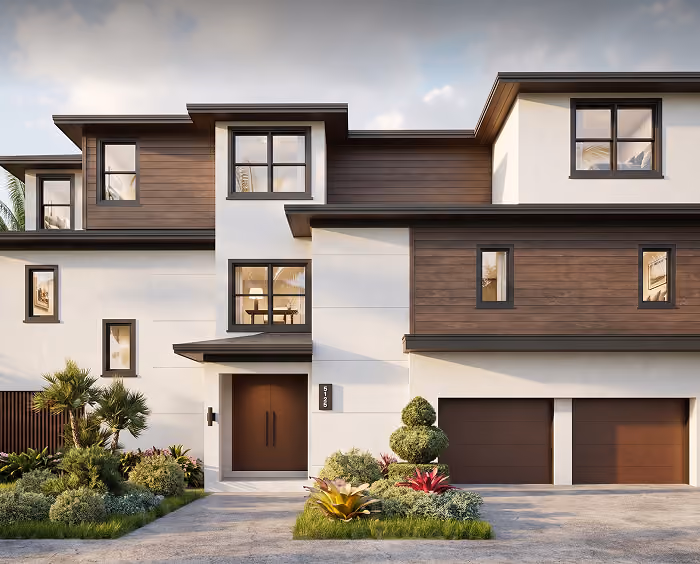 Modern two-story house with white and wood exterior, large windows, front door, and double garage.