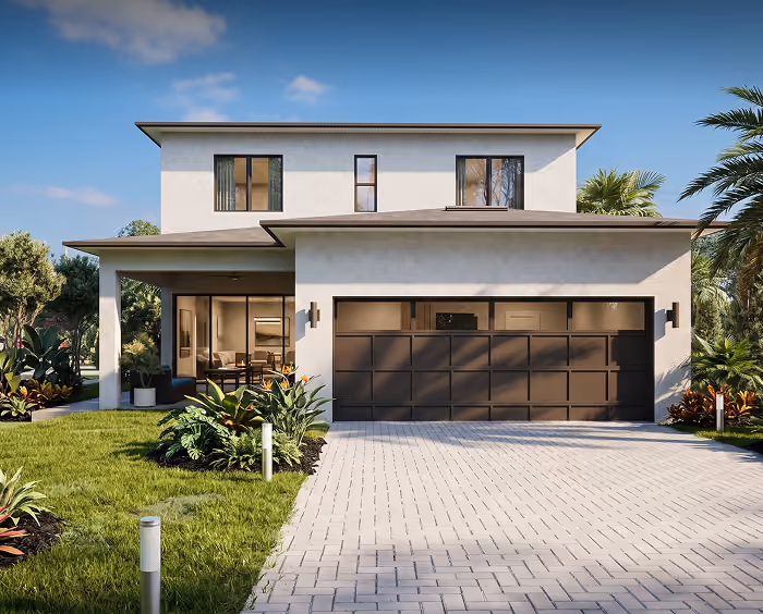 Modern two-story house with large garage, landscaped yard, and clear blue sky background.