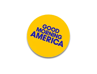 A yellow button with the words good morning america on it.