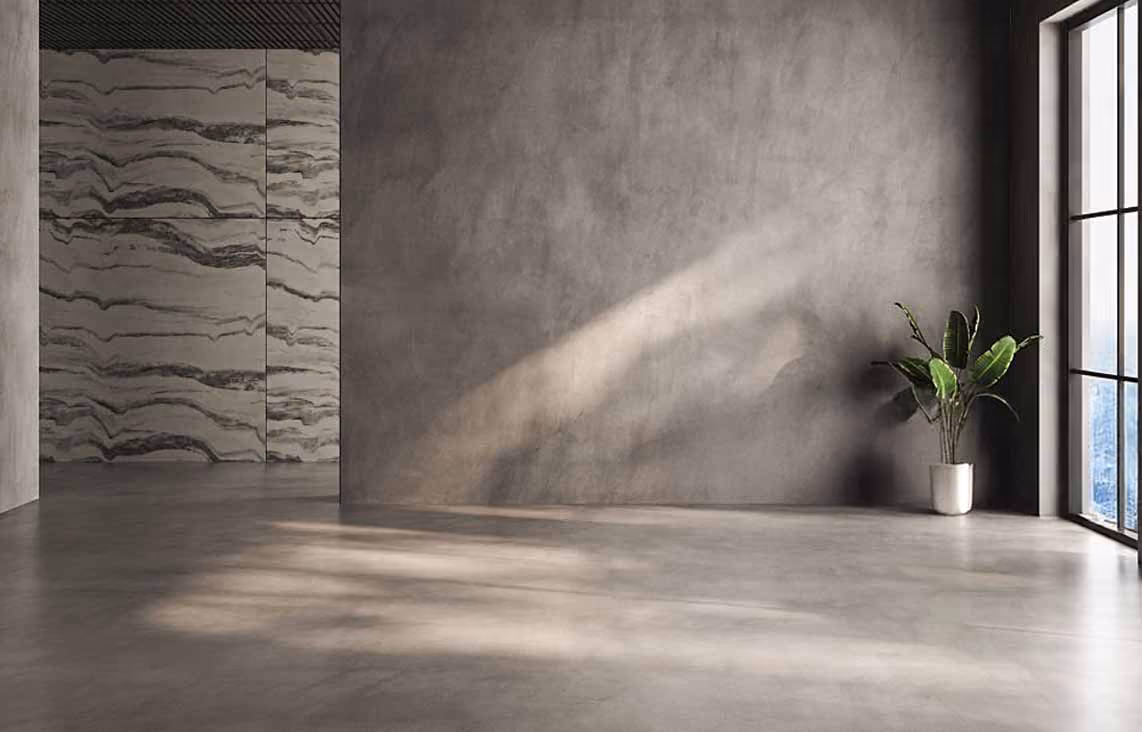 Empty modern room with concrete floor, large window, gray walls, and a potted plant by the window.