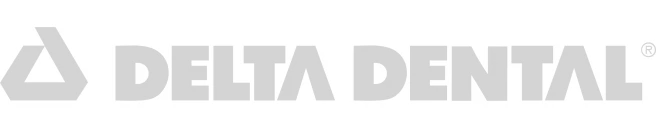 Delta Dental logo in gray with a triangular icon to the left.