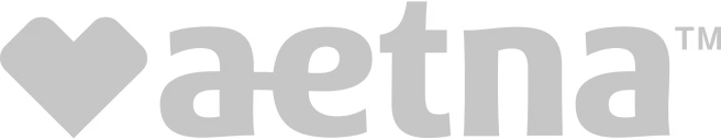 Aetna company logo with a stylized heart shape.