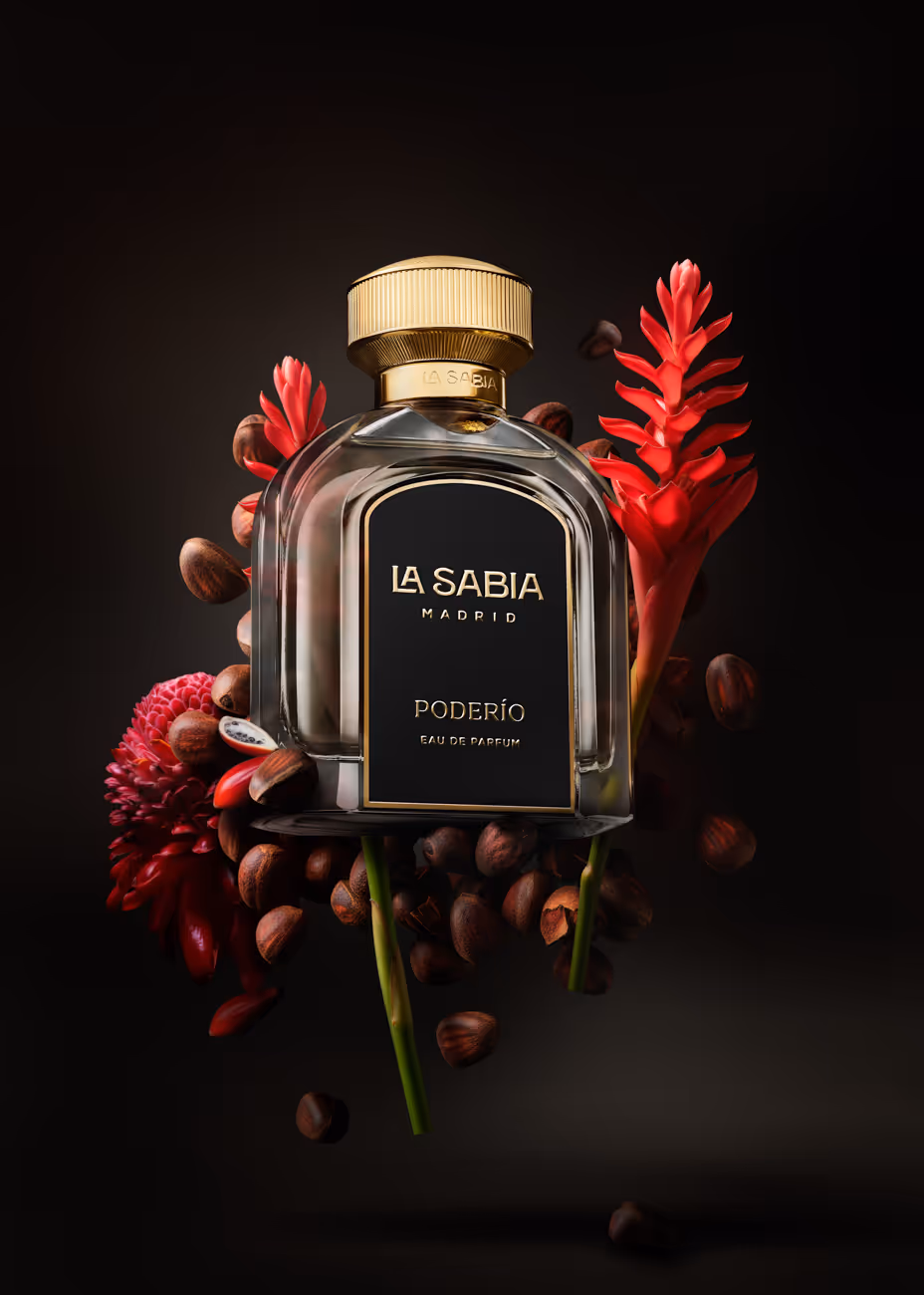 La Sabia Madrid Poderío Eau de Parfum bottle surrounded by red flowers and brown seeds on black background.