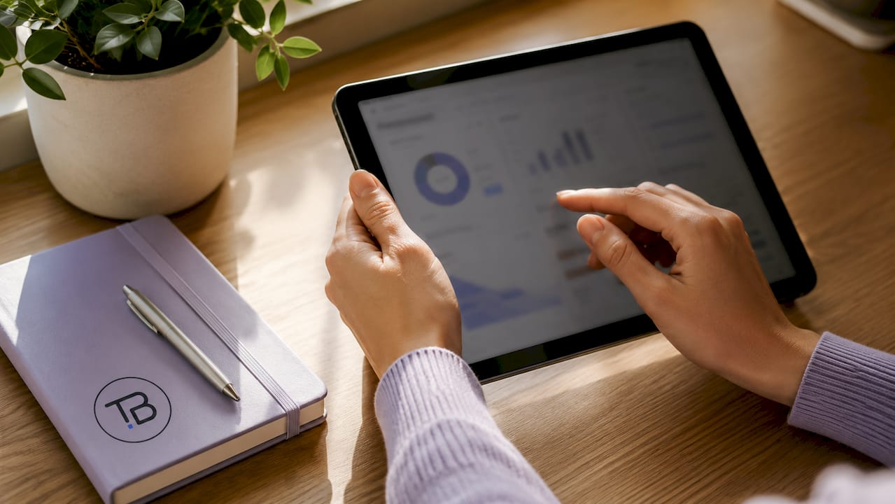 Hands interacting with data cost audit tablet