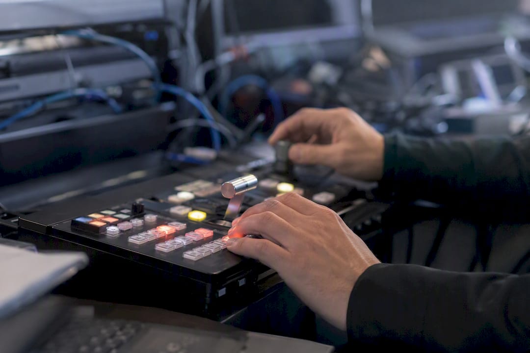 Hands adjusting automation control panel