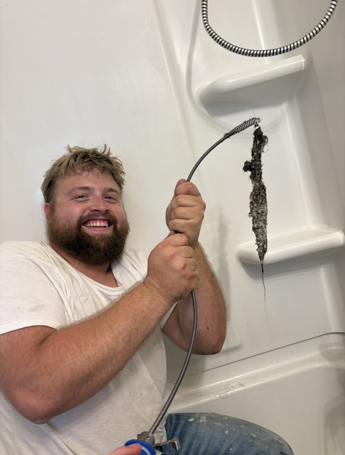 In-house maintenance team clearing a clogged drain