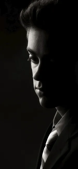 Dramatic senior portrait by Plano photographer Larry Lourcey