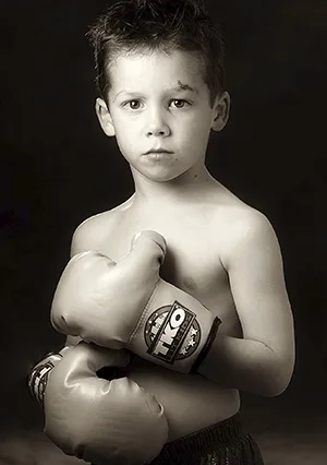 portrait of a child dressed as a boxer