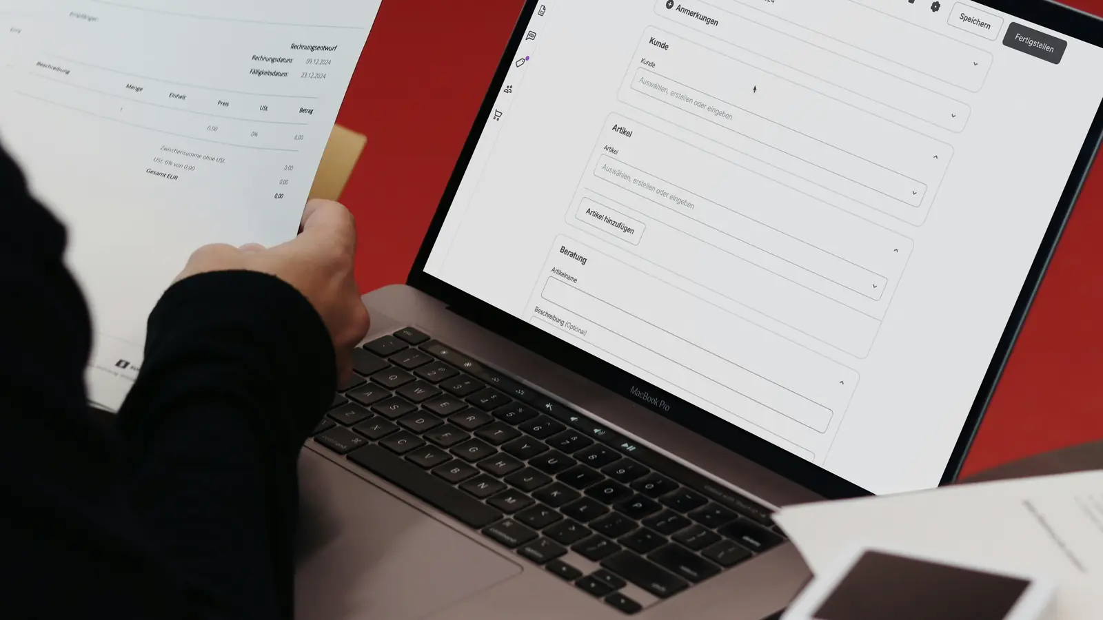 Person checking a printed invoice against itemized charges in billing software on a laptop