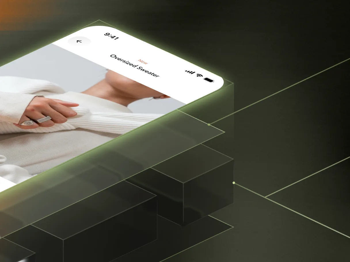 Mobile app product screen for an oversized sweater on a phone floating above a dark green geometric platform.