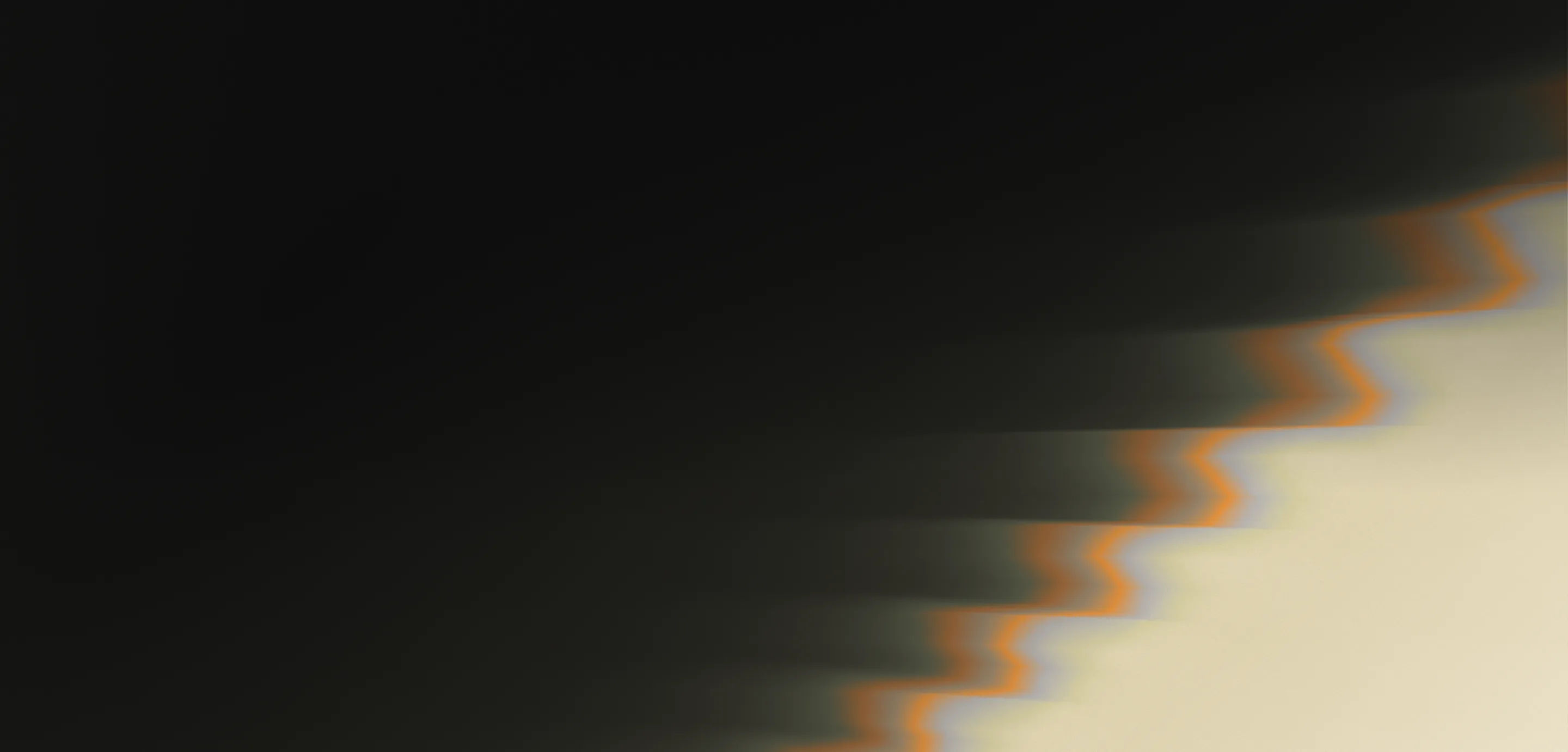 Abstract gradient with dark shapes fading into light area with blurred orange zigzag edges on right.