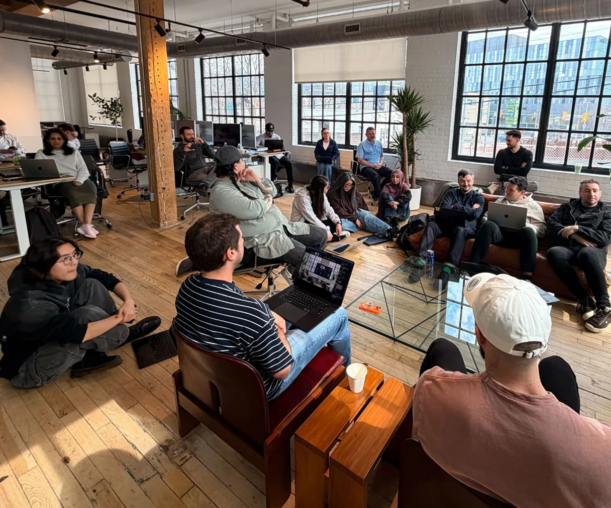 The Reactiv team gathered together during a meeting in their office