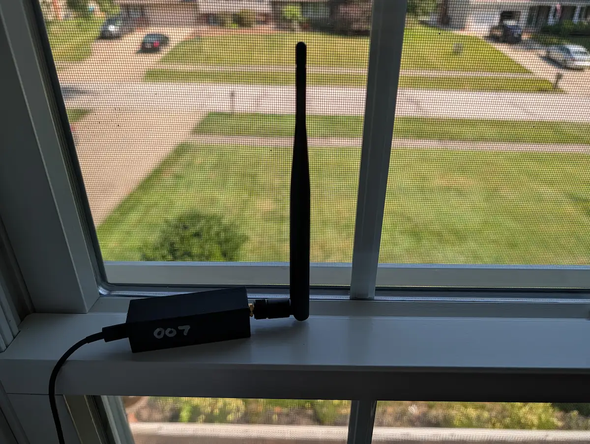 DroneSight receiver mounted on a window sill, antenna facing outside