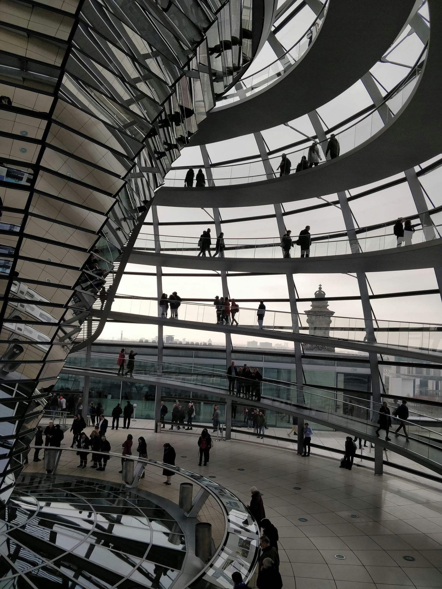 Spiral walkway inside the glass dome of a parliament building