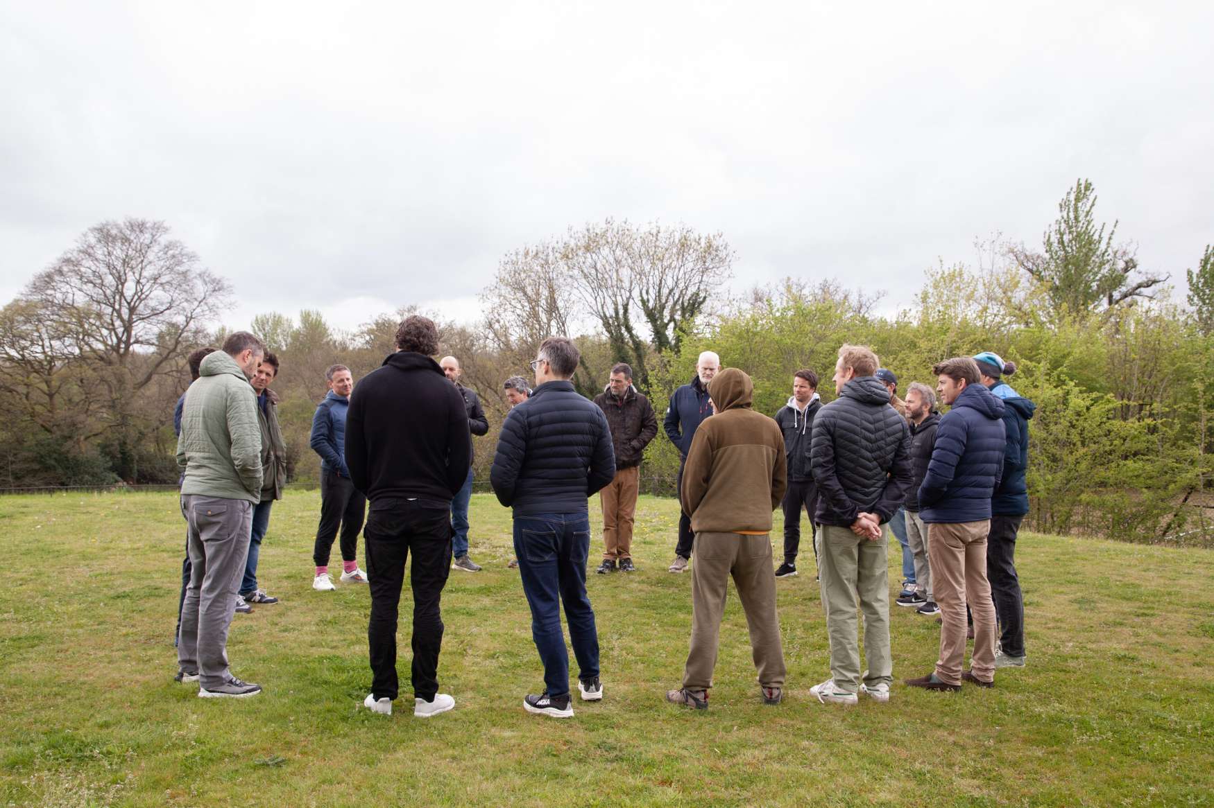 Monumental members gathered in an open field