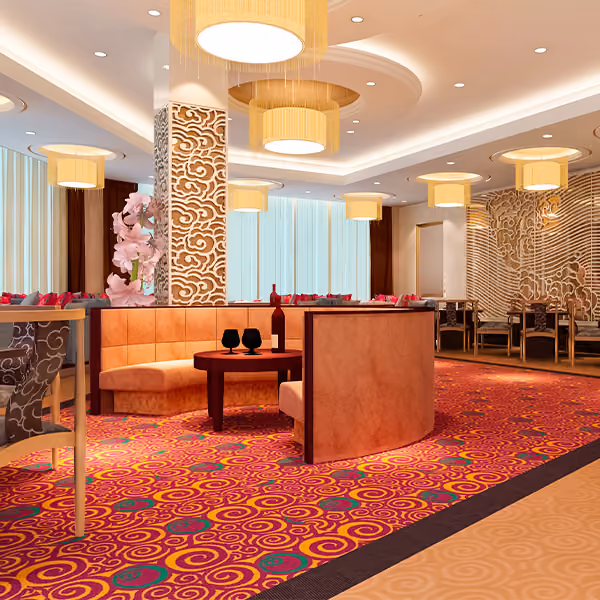Modern restaurant interior with patterned carpet, orange seating, round table, and hanging lamps.