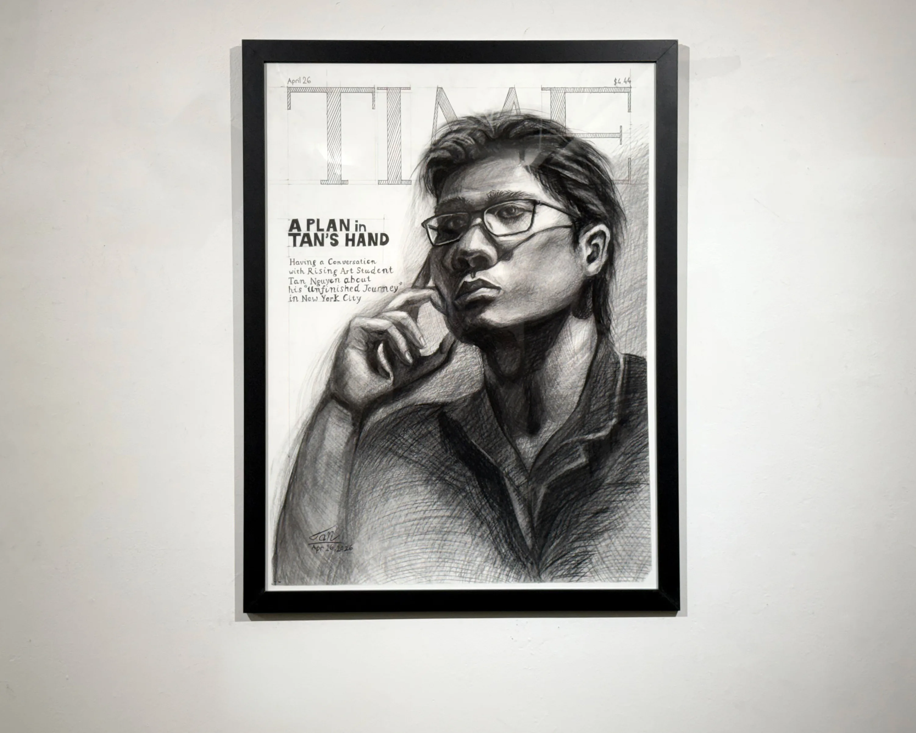 The finished drawing framed in black on a white wall, seen straight on.
