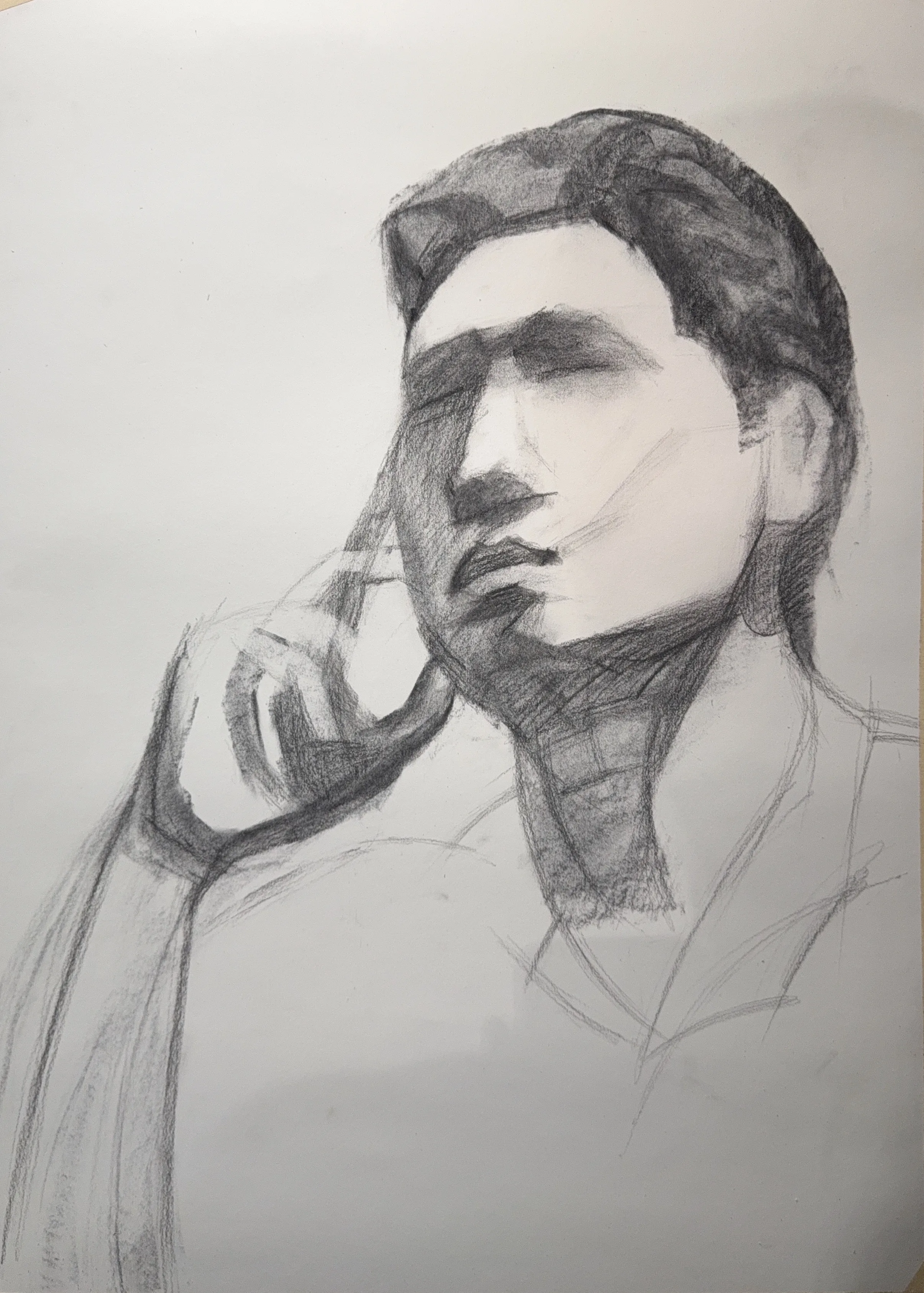Second stage with the features emerging and the hand at the chin more defined, the eyes still soft.