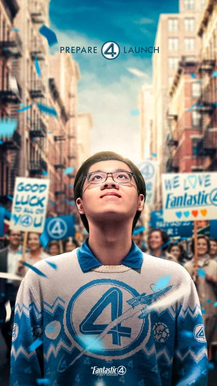 Composite poster of a young man in a knitted four jumper looking upward through blue confetti on a New York street, crowds holding hand-painted good luck and we love Fantastic Four signs.