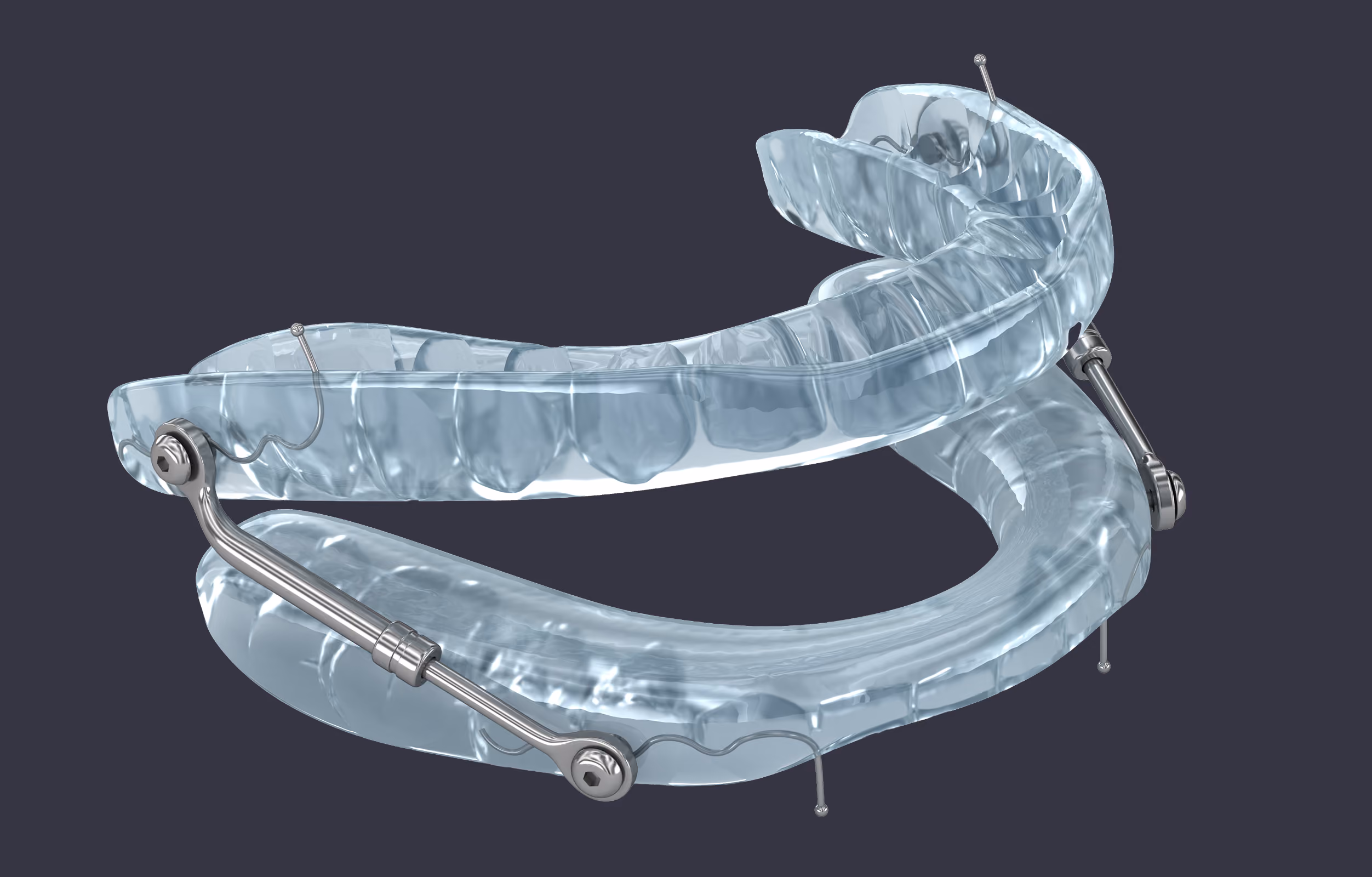 Clear dental appliance with metal hinges on a dark background.