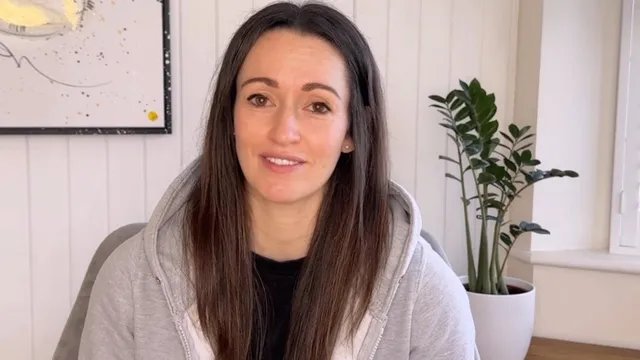 Katie sat in front of camera