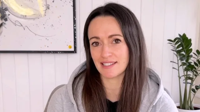 Katie in front of camera smiling
