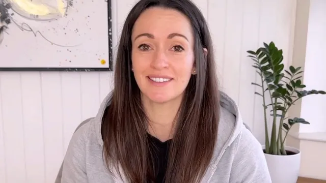Katie smiling in front of camera