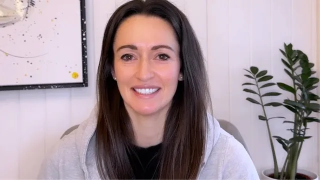 Katie sat in front of the camera smiling