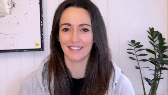 Katie sat in front of camera