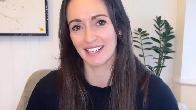 Katie sat in front of camera